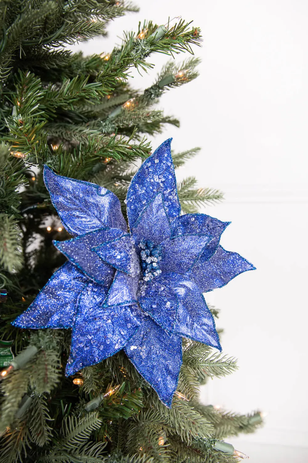 Decorator's Warehouse 24” x 11" Glitter Iced Poinsettia Stem - Midnight Blue > Nutcracker|Christmas Decor